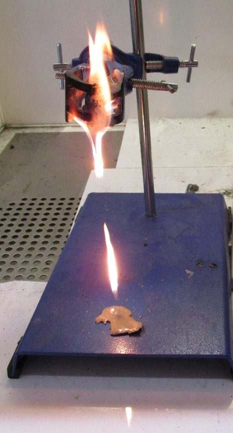 Needle-flame test on a material sample